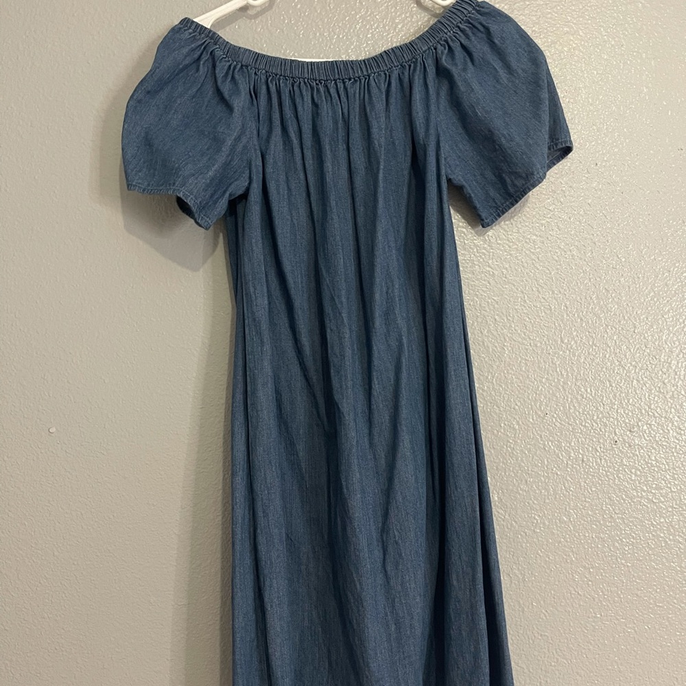 Light blue dress, it’s off the shoulder